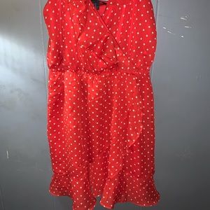 Spaghetti strap red dress with white polka dots.